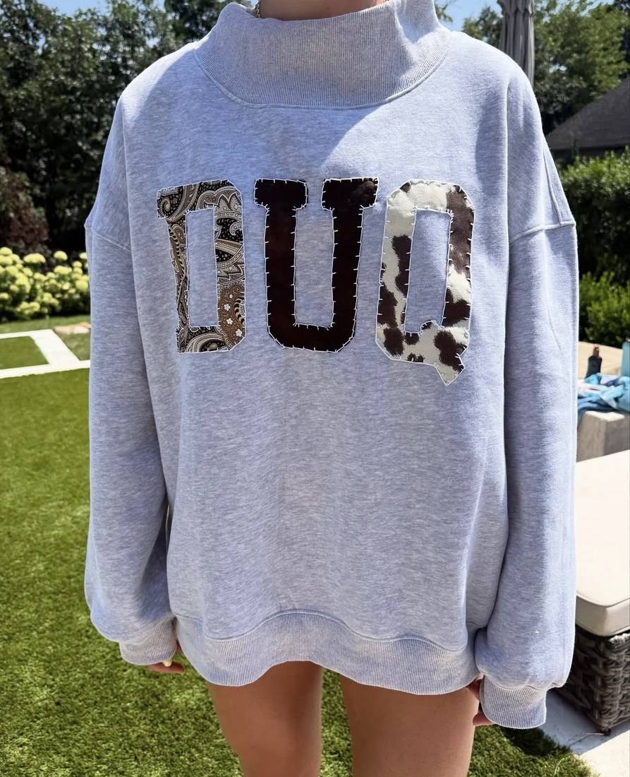 DUQ cow print mockneck